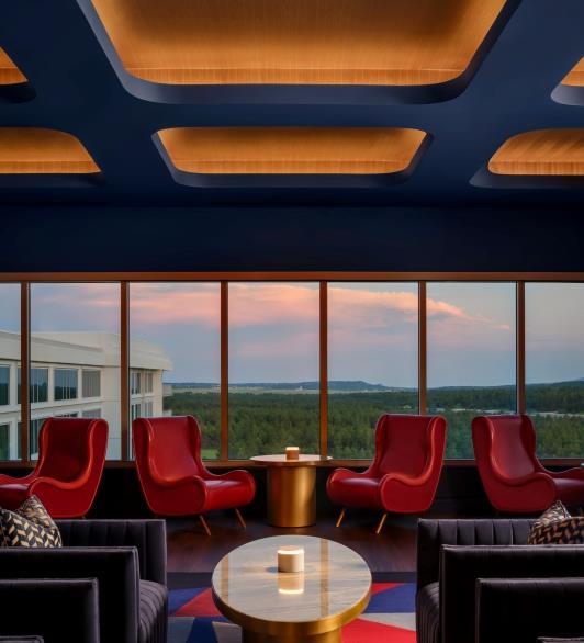 Seating at the Aviator that looks out at mountains during sunset