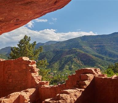 cliff dwellings with a view of the mountains